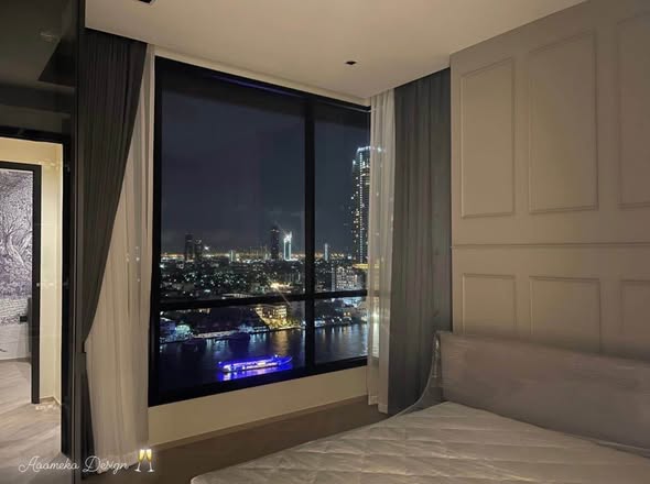 living room and bedroom of Chapter Charoennakhon–Riverside