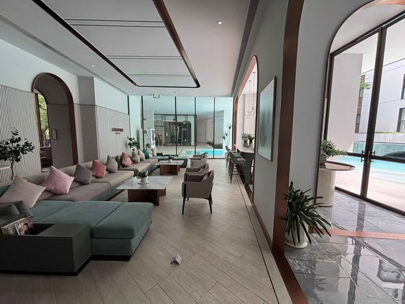 living room and pool of CHAPTER THONGLOR 25