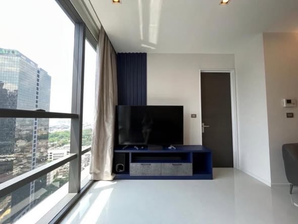living room and bedroom of The Bangkok Sathorn