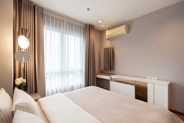 bedroom of MB Grand Residence