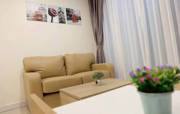 living room and bedroom of TC-Green Condominium