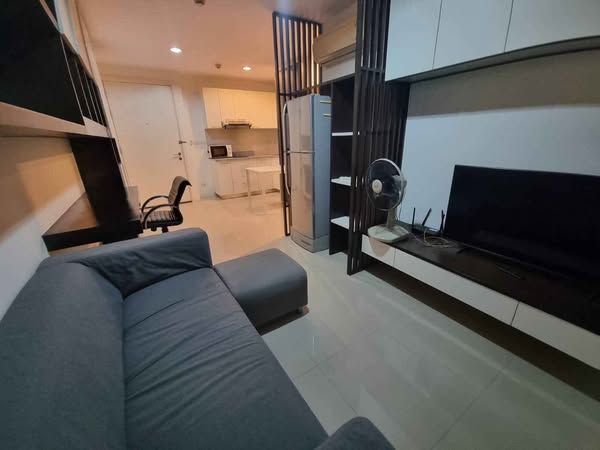 bedroom and living room of The Silk Aree 2 Condominium