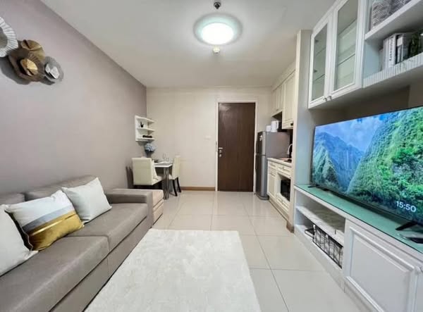 bedroom and living room of IVY River Condo