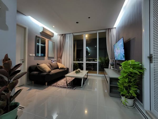 living room and bedroom of TC-Green Condominium