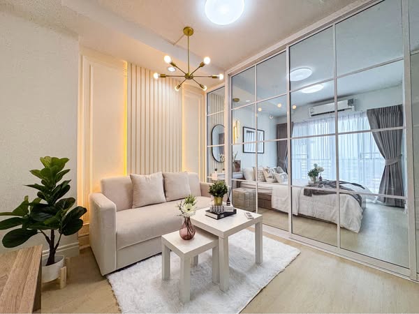bedroom and living room of The Log 3 Condominium