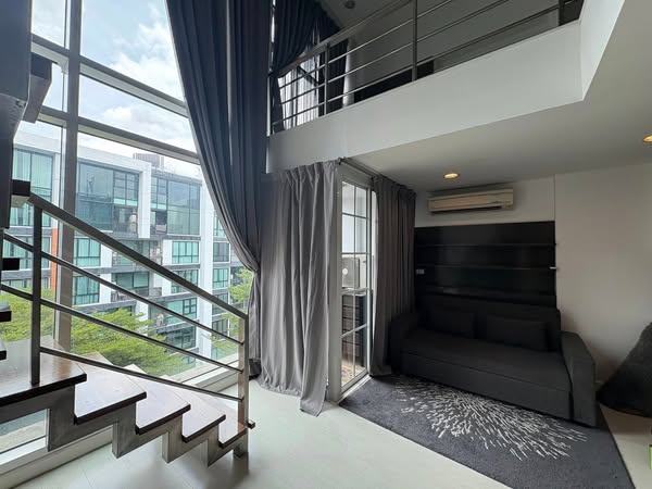 living room and bedroom of D65 Condominium