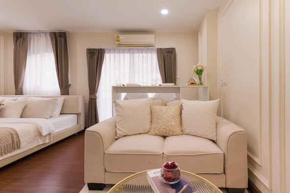 living room and bedroom of The Escape Condominium – ดิ เอสเคป คอนโดมิเนียม
