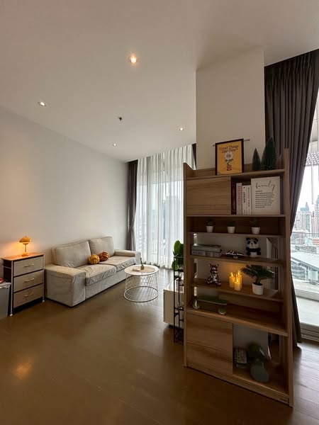 living room and bedroom of Magnolias Ratchadamri Boulevard