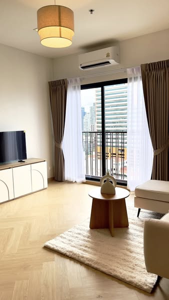 living room and bedroom of Noble Reveal