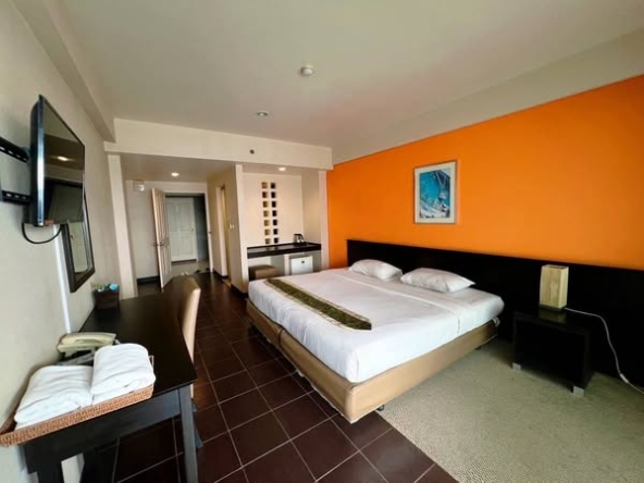 bedroom of The Color Living Hotel