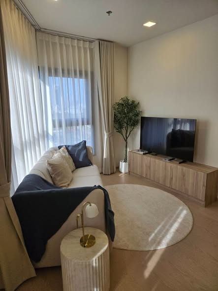 living room and bedroom of The Base Urban Rama9