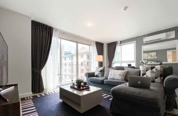 bedroom and living room of The Clover