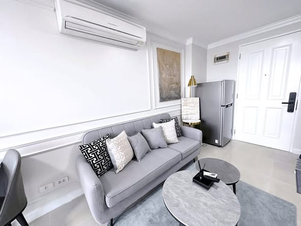 bedroom and living room of The Clover