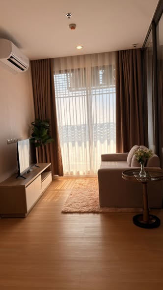 living room and bedroom of The Cuvee Tiwanon