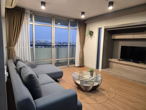 living room and bedroom of Riviera Condominium