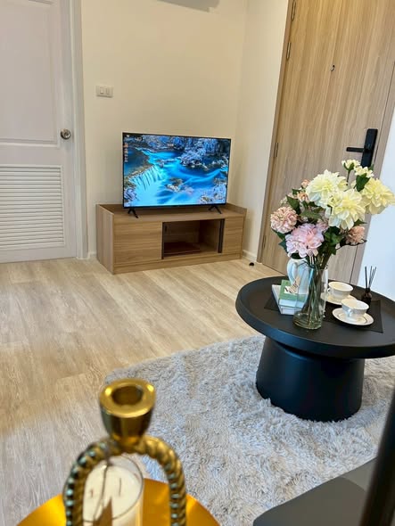 living room and bathroom of The Clev Riverline Chaophraya – Wong Sawang