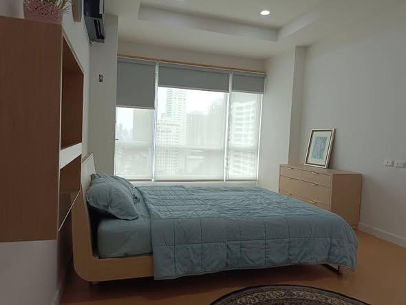 bedroom of The Trendy Condominium