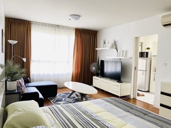 living room and bedroom of Condo One X