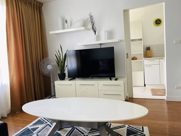 living room and bedroom of Condo One X