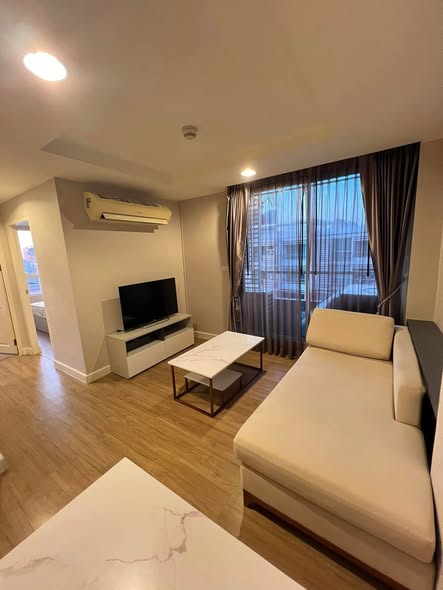 bedroom and living room of The Kris 7