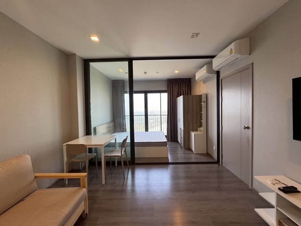 living room and bedroom of The Politan Aqua