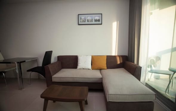 bedroom and living room of The River Condominium