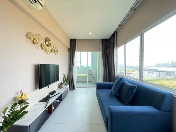 living room and bedroom of 103 Central condominium
