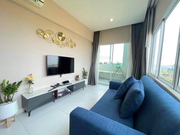 living room and bedroom of 103 Central condominium