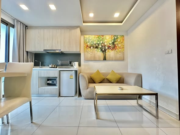 bedroom and living room of Arcadia Beach Resort Condominium