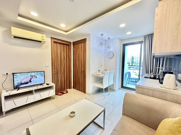 living room and bedroom of Arcadia Beach Resort Condominium