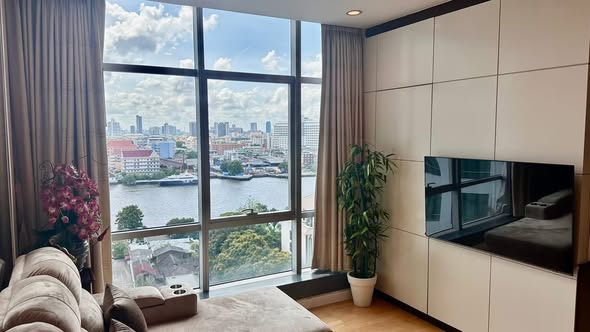 living room and bedroom of Baan Sathorn Chao Phraya