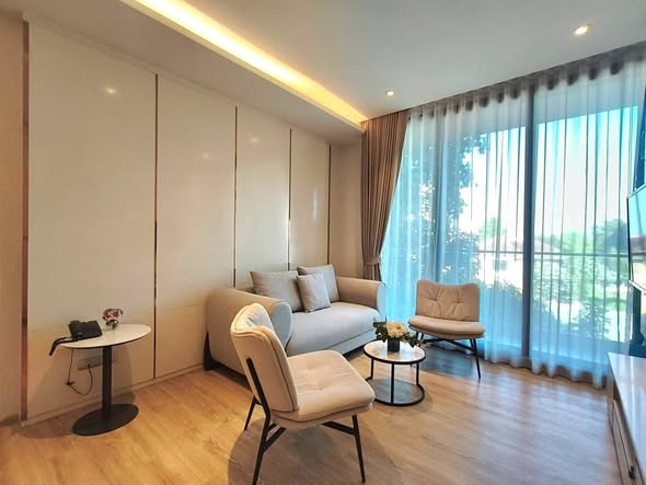 bedroom and living room of Bearing Residence