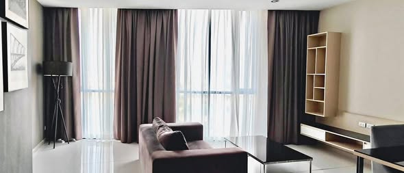 bedroom and living room of อัพเอกมัยคอนโดมิเนียม