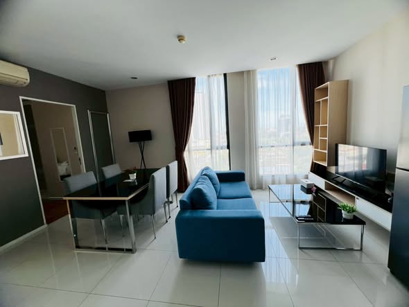 bedroom and living room of อัพเอกมัยคอนโดมิเนียม