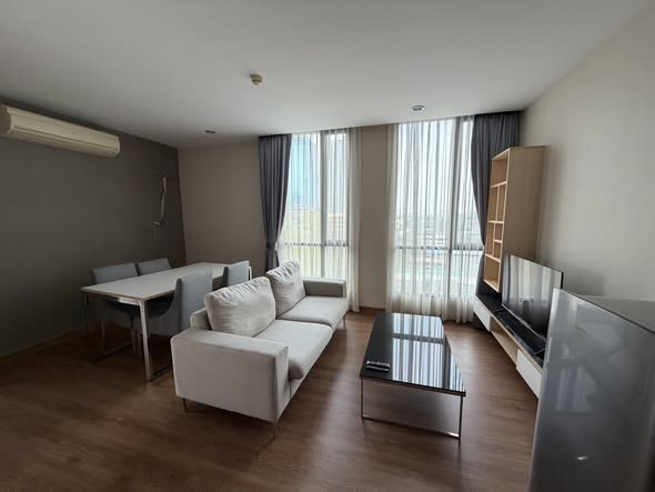 bedroom and living room of อัพเอกมัยคอนโดมิเนียม