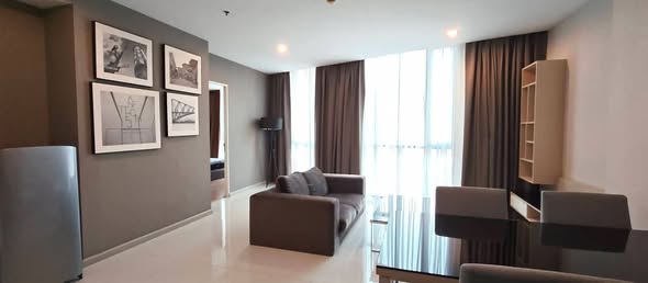 bedroom and living room of อัพเอกมัยคอนโดมิเนียม