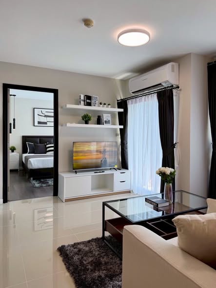 bedroom and living room of ดีคอนโด แคมปัส รีสอร์ท กู้กู ภูเก็ต
