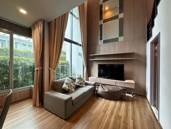 bedroom and living room of CEIL By Sansiri