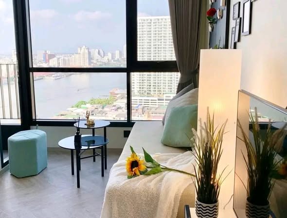 living room and bedroom of Chapter Charoennakhon–Riverside