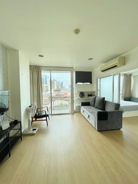 bedroom and living room of D65 Condominium