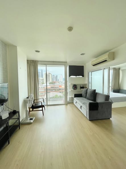 living room and bedroom of D65 Condominium