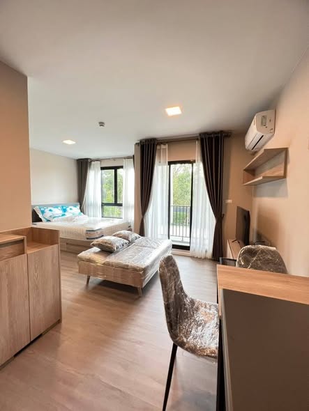 bedroom and living room of dcondo Campus Hideaway