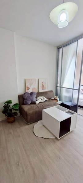 bedroom and living room of Dsign Condominium