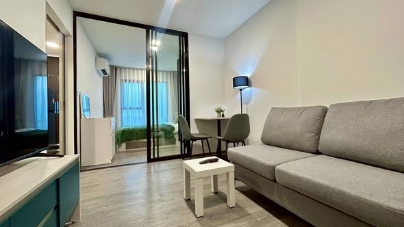 living room and bedroom of Kave Wonderland Sales Gallery