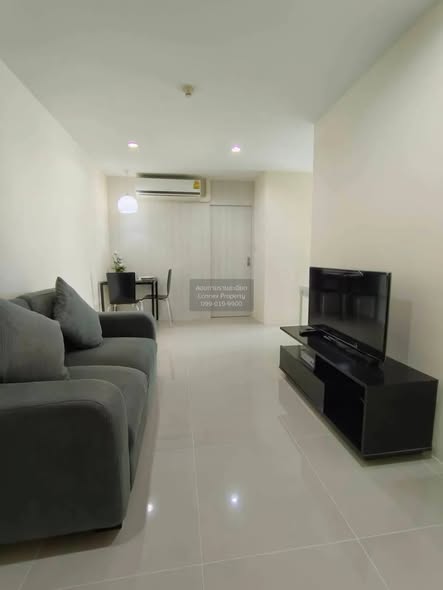bedroom and living room of KES Ratchada Condominium