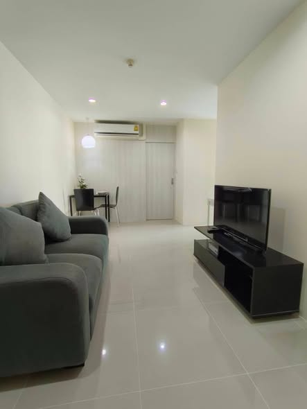 bedroom and living room of KES Ratchada Condominium