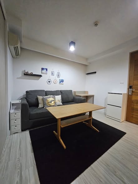 bedroom and living room of L Style Condo