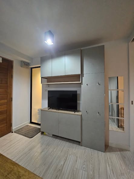 room interior and kitchen of L Style Condo
