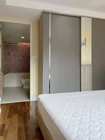 bedroom and room interior of LE NICE CONDO