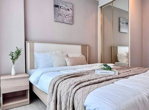 bedroom of Metro Luxe Riverfront Rattanathibet